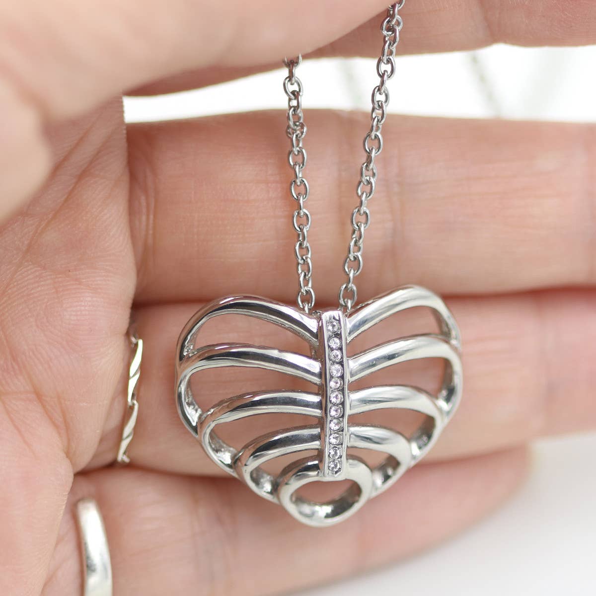Elegant Ribcage Necklace Heart Pendant Design with Crystal