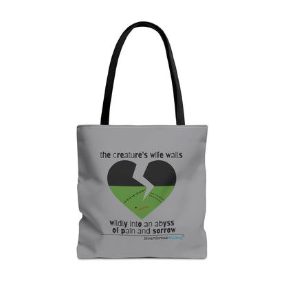 The Creature's Wife Wails Frankenstein Haiku tote bag featuring a heart design on a stone grey background.