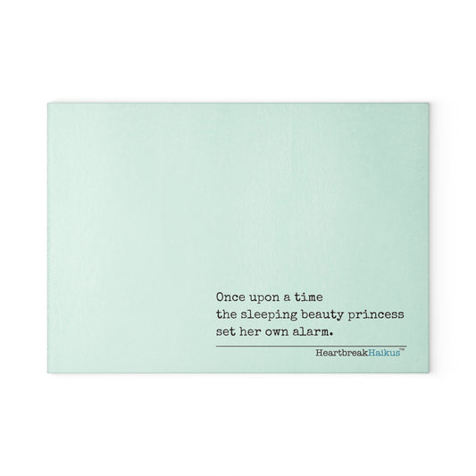 This cutting board features an original Heartbreak Haiku, perfect for adding a touch of creativity to your kitchen. The durable tempered glass material makes it a versatile preparation surface, while the vibrant colors and unique decoration process ensure