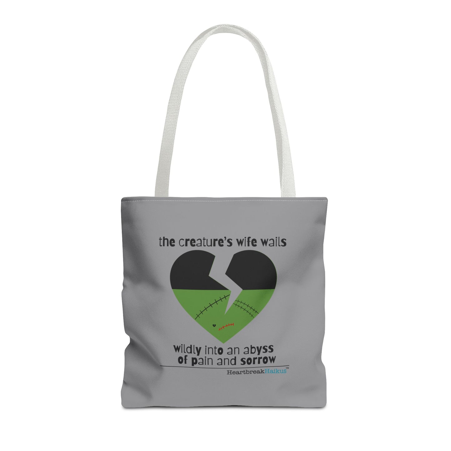 The Creature's Wife Wails Frankenstein Haiku tote bag design in stone grey, featuring a heart graphic and poignant text.
