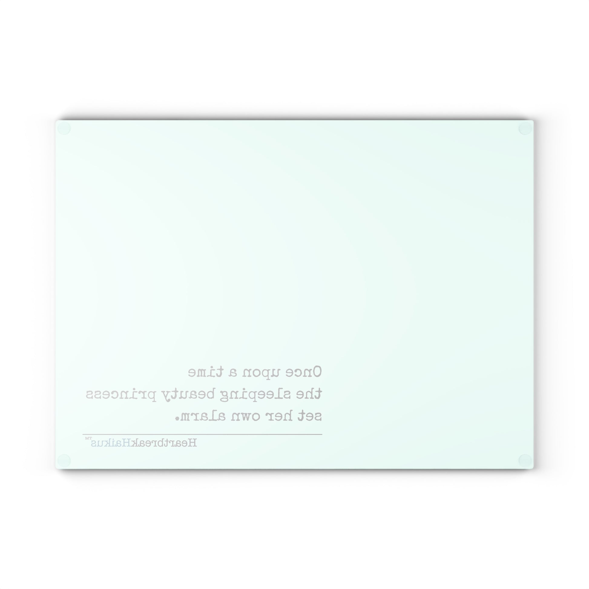 This cutting board features an original Heartbreak Haiku, perfect for adding a touch of creativity to your kitchen. The durable tempered glass material makes it a versatile preparation surface, while the vibrant colors and unique decoration process ensure