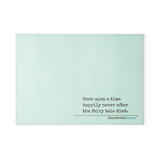 This cutting board features an original Heartbreak Haiku, perfect for adding a touch of creativity to your kitchen. The durable tempered glass material makes it a versatile preparation surface, while the vibrant colors and unique decoration process ensure