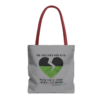 The Creature's Wife Wails Frankenstein Haiku tote bag in stone grey with artistic heart design.