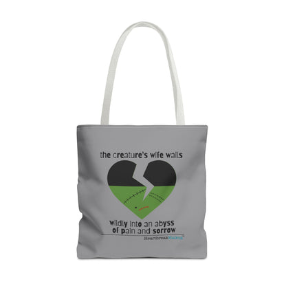 The Creature's Wife Wails Frankenstein Haiku tote bag in stone grey with heart design and emotional text.